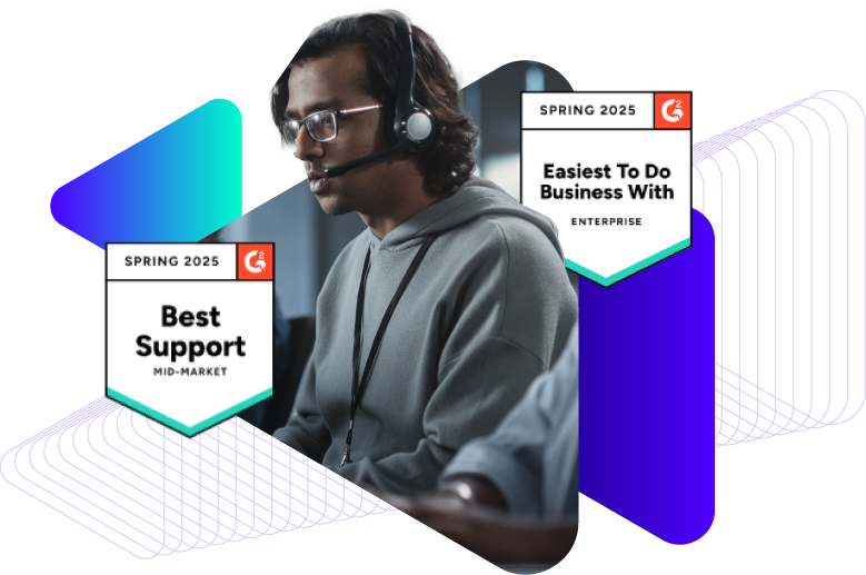 Support engineer sitting at computer. Two G2 awards.