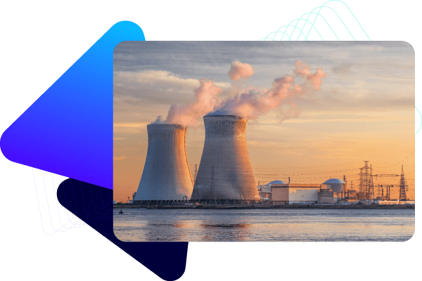 Factory reactors on riverbank.