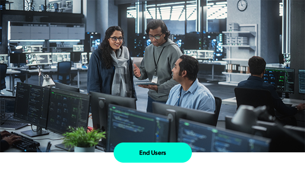 People standing around a computer.