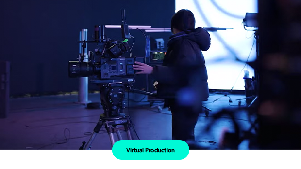 Person operating large camera.