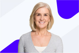 A smiling woman with blonde hair, wearing a light gray cardigan, stands in front of a white background with blue shapes.