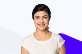 A smiling young woman with dark hair wearing a white shirt against a light background with blue accents.